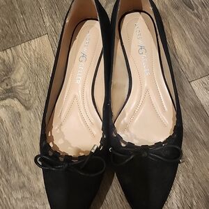 Women, black flat shoes.